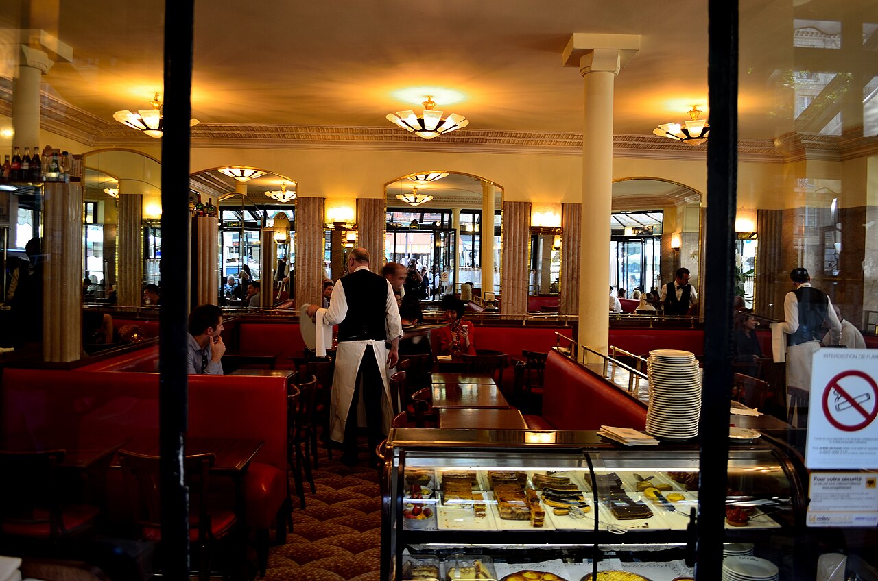 The terrace of Café de Flore in Paris with its classic awning and wicker chairs