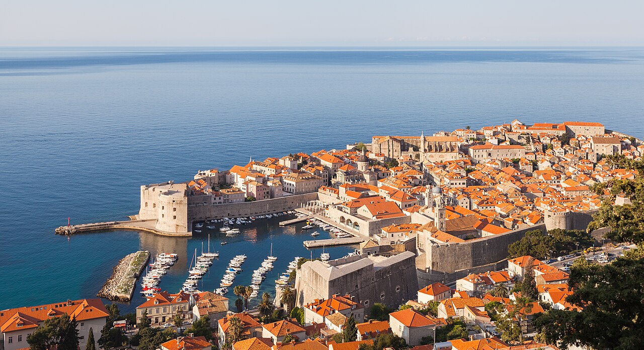 The old town of Dubrovnik with its walls above the deep blue Adriatic sea