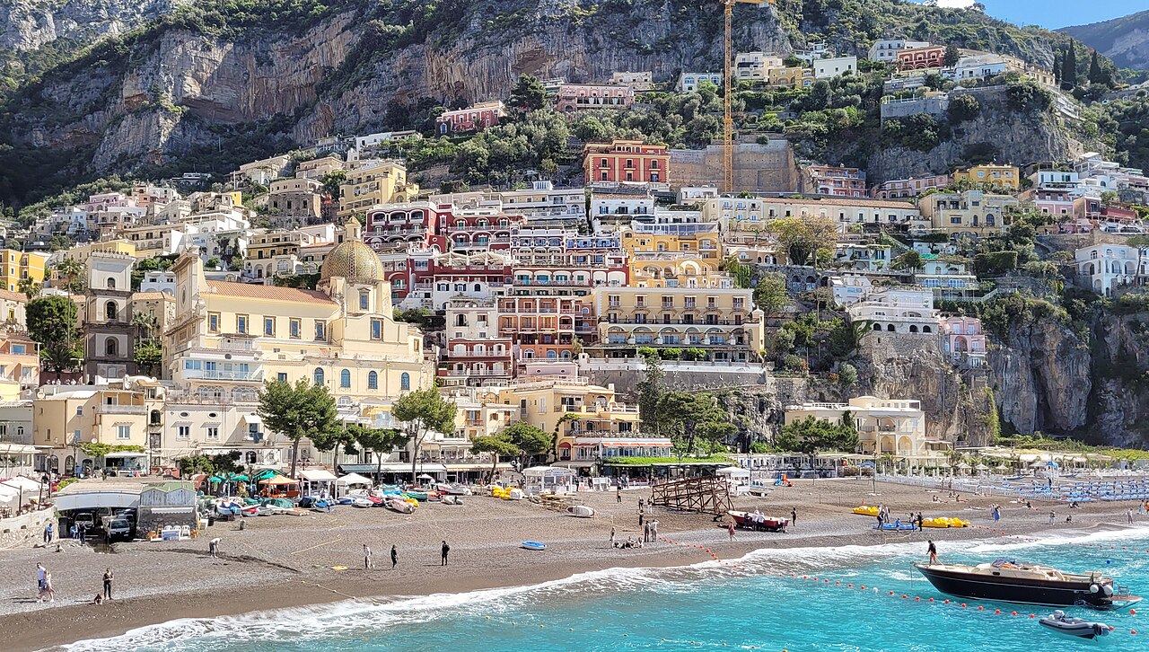 The pastel houses of Positano stacked above the sea on the Amalfi Coast
