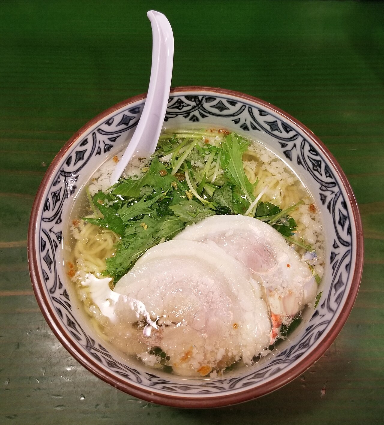 A bowl of shio ramen with toppings at a Japanese ramen restaurant