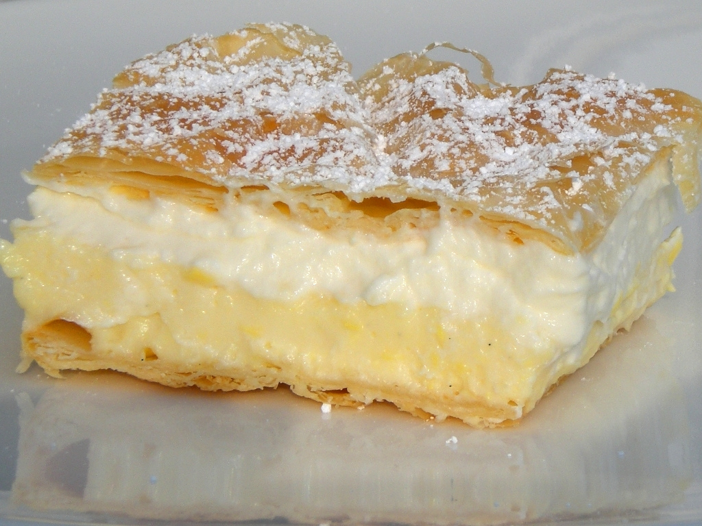 A slice of Bled cream cake, kremšnita, with custard and cream layers