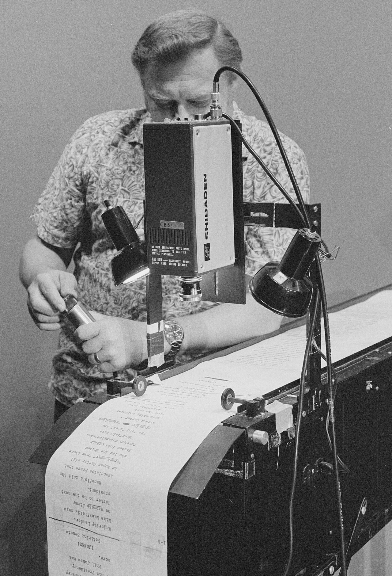 A man preparing a speech text for a teleprompter, mid-20th century